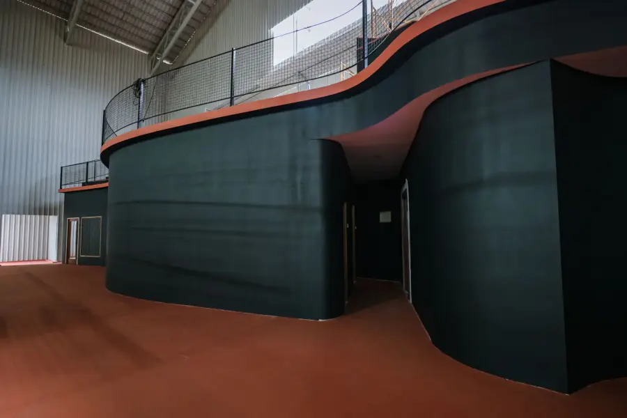 The curved spectator tribune above the courts